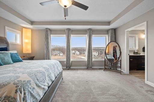 The primary bedroom is a calming, private oasis.