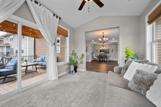 The four-season porch is filled with natural light and patio door access to the maintenance free deck.