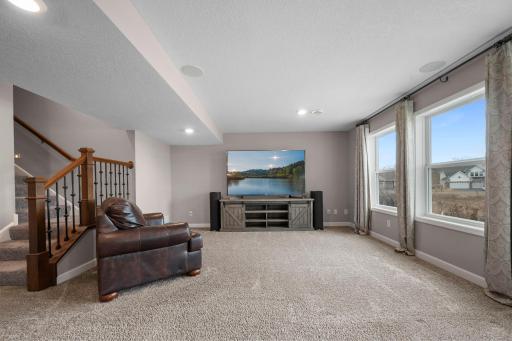 The basement family room has extra large windows overlooking the backyard.