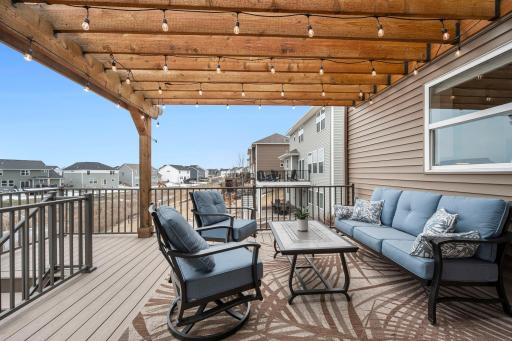 The maintenance free deck and pergola are the perfect place to sit and watch pond wildlife.