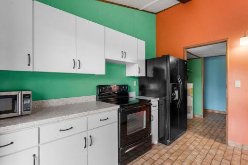 Spacious kitchen with modern white cabinetry.
