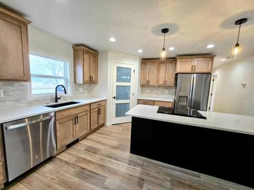 Luxury vinyl plank flooring throughout main floor