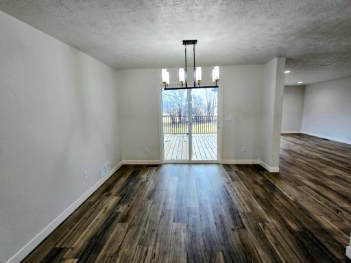 Formal dining with patio doors to deck-beautiful chandelier
