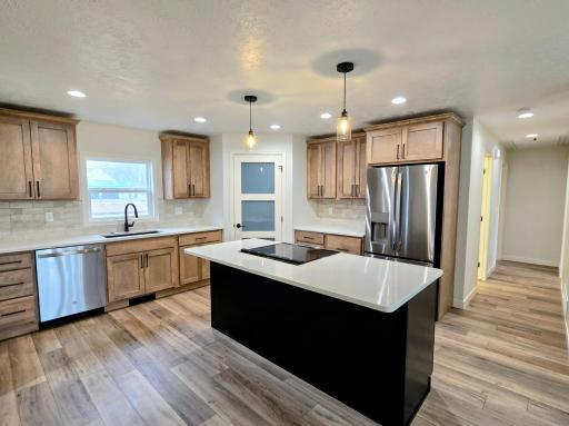 Recessed lighting throughout the house along with attractive fixtures