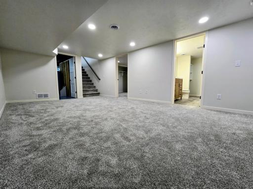 Door to utility room, a bonus room and bath room