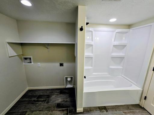 Hookups for washer and dryer and surround for tub and shower