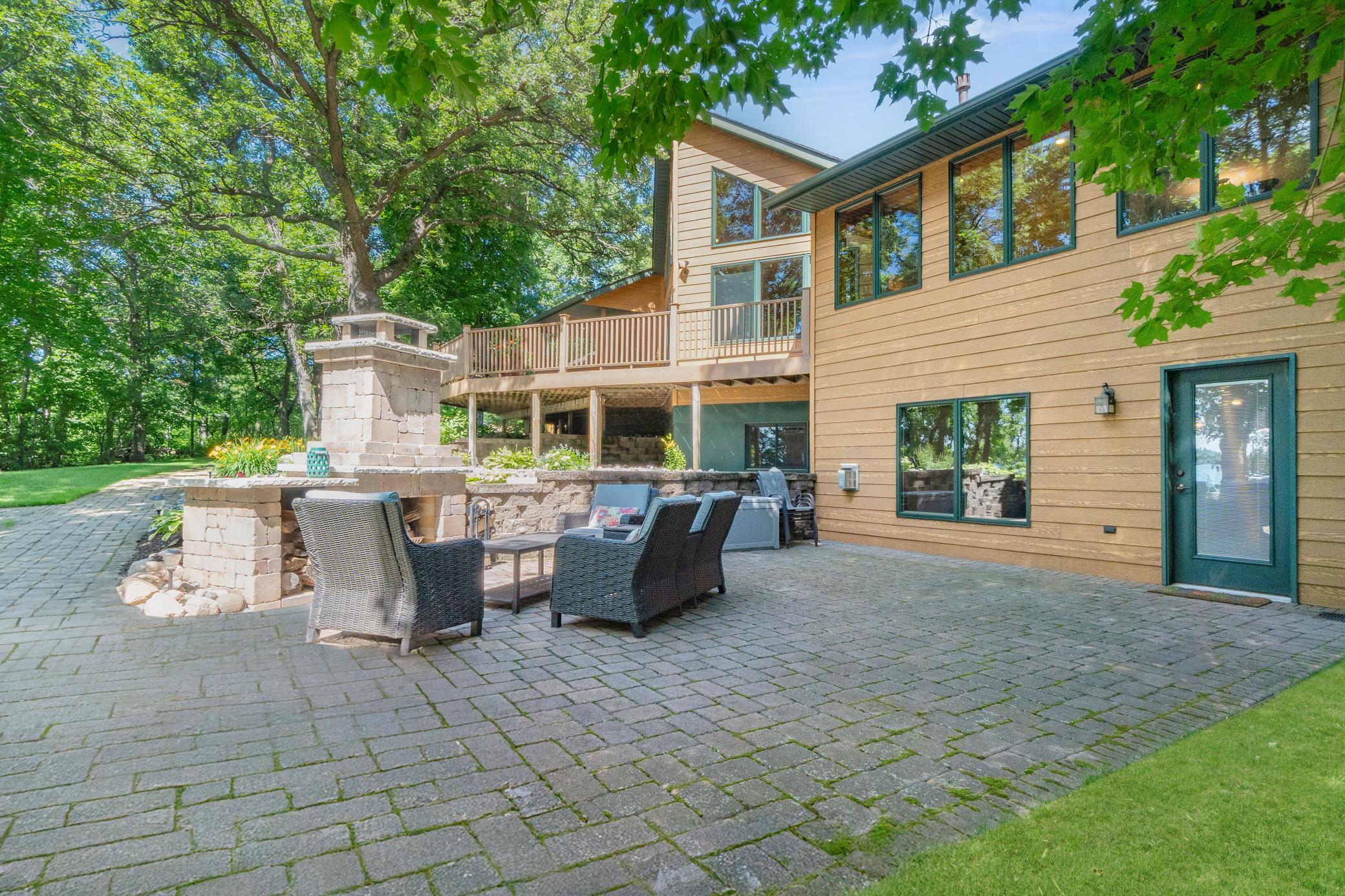 Large paver patio overlooks the lake