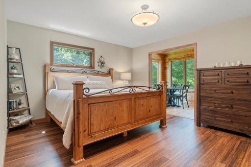 Primary bedroom on main level with views of the lake