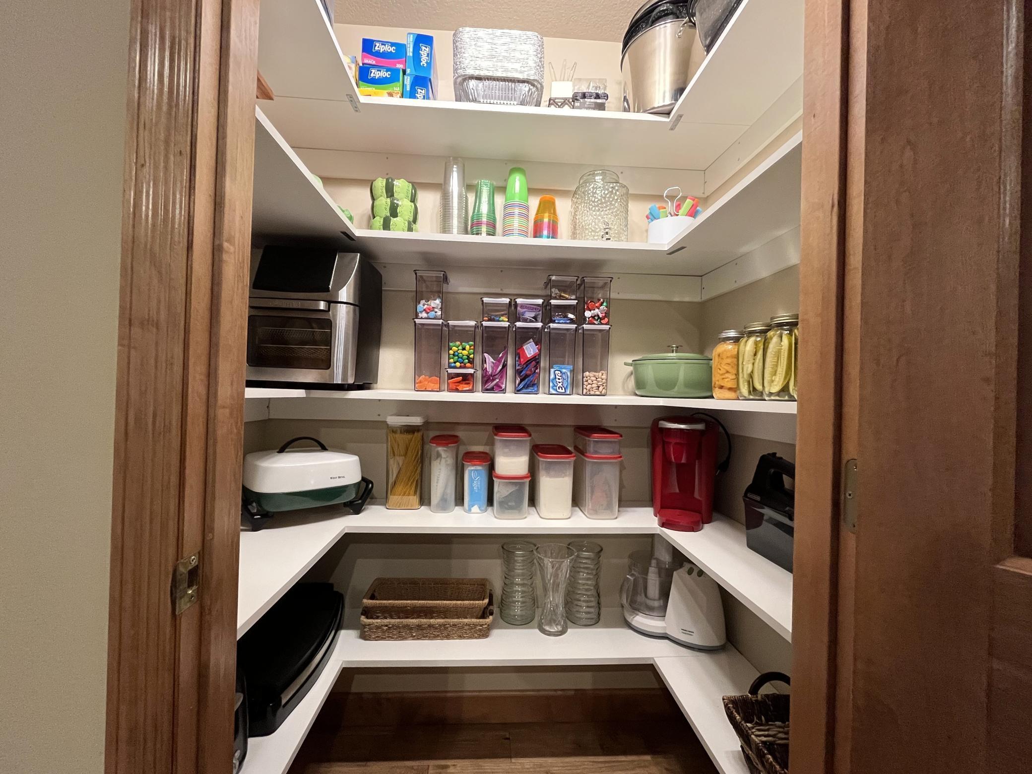 Walk in pantry with 5 levels of shelving
