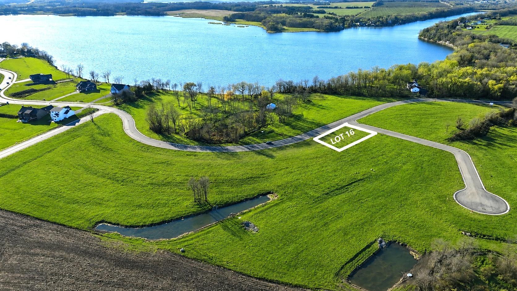 CORNER LOT 16 is an oversized .39 acre lot on a cul-de-sac across from Lake John.