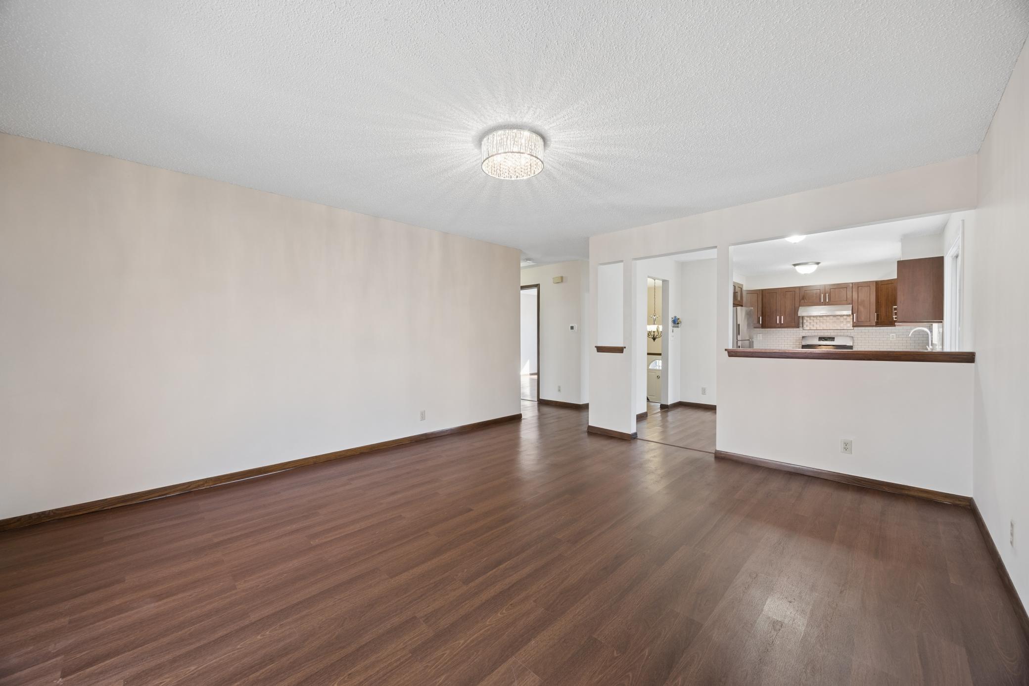The main level features luxury plank flooring throughout, creating a stylish, low-maintenance living space