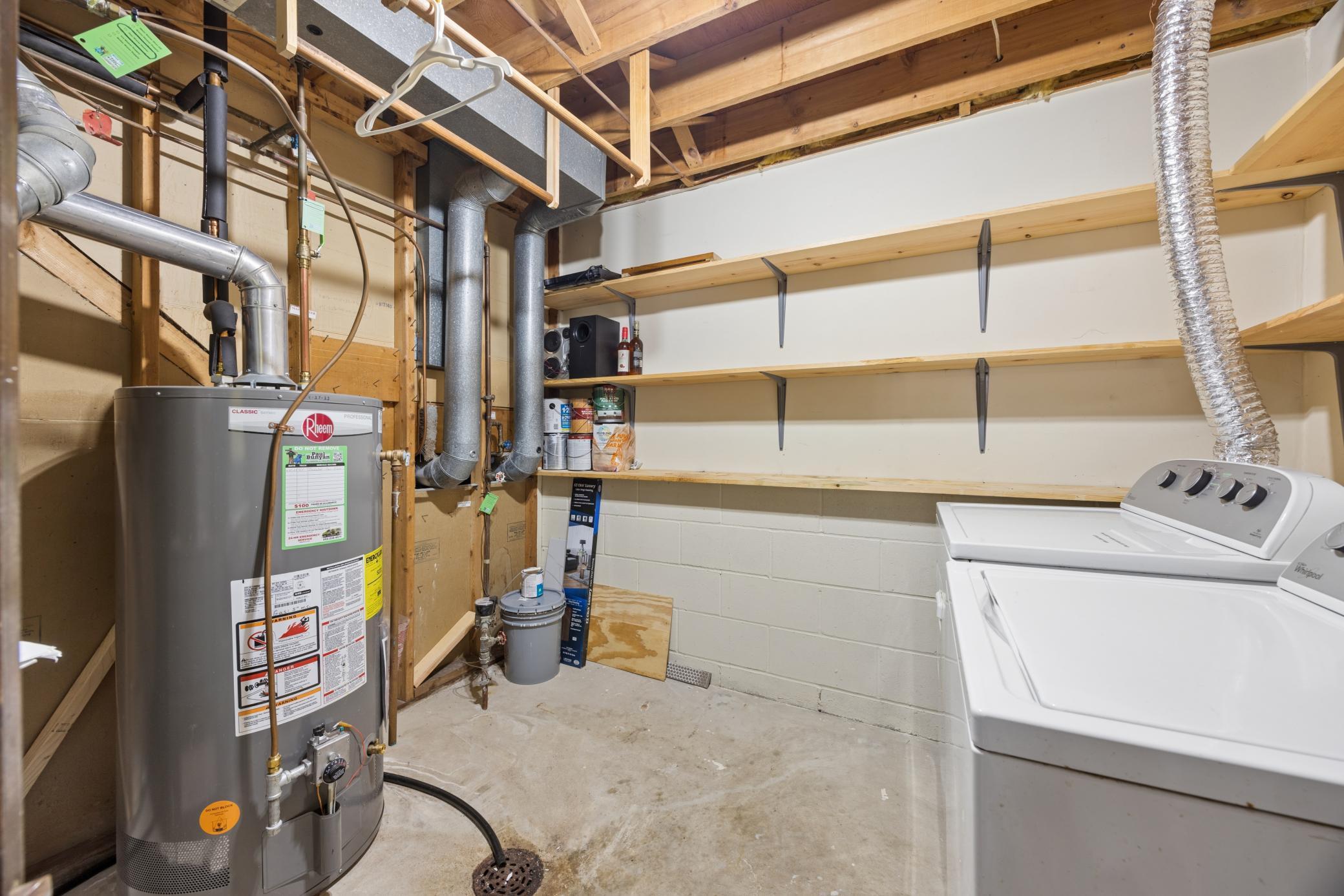 Laundry/Utility room with extra storage space and shelves