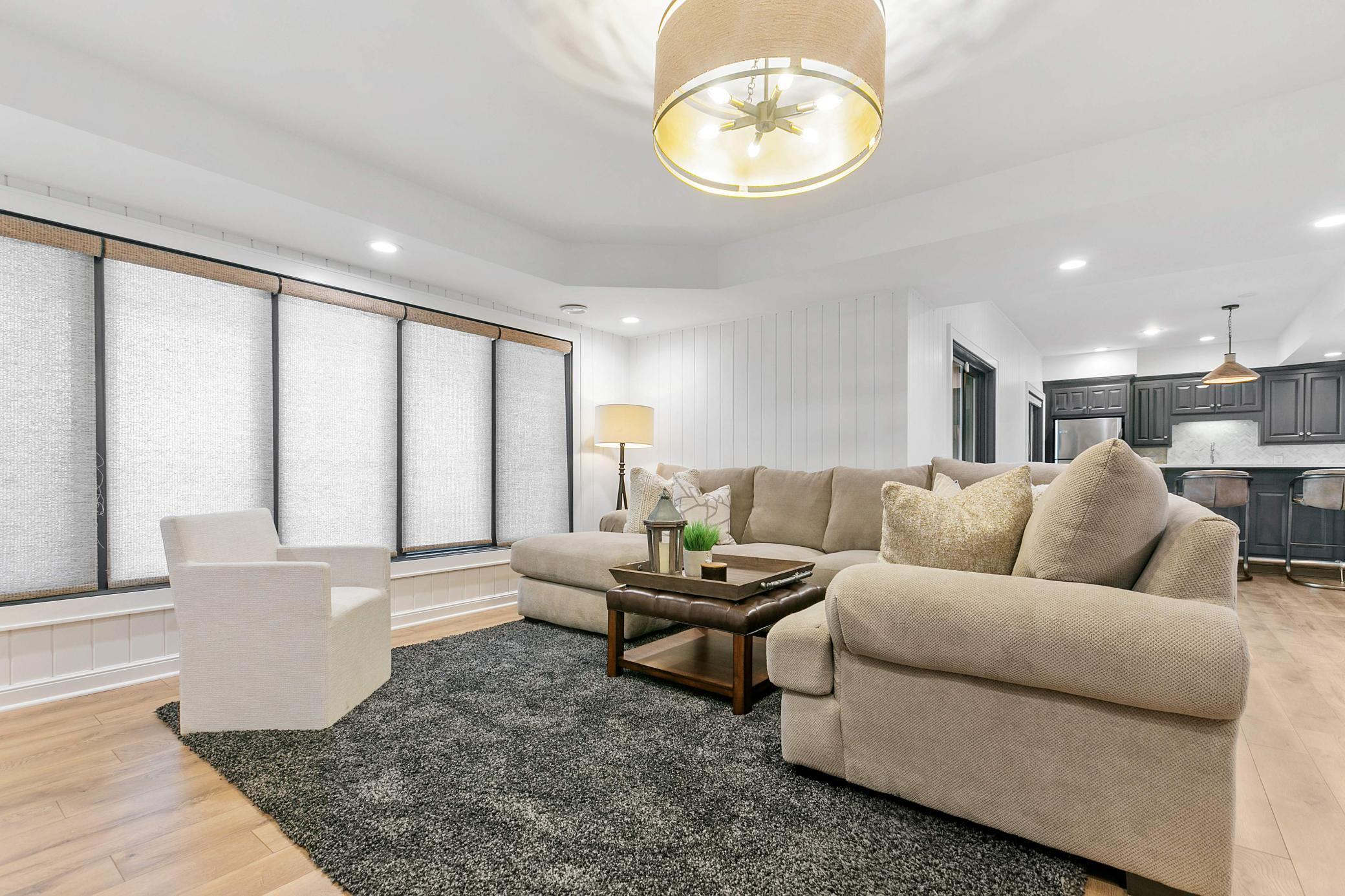 Just off the family room is a game room and second kitchen with on trend cabinetry, counters and back splash. There is also another bedroom, bathroom, flex room and gigantic storage room on the lowest level. The perfect lake entertainment space!
