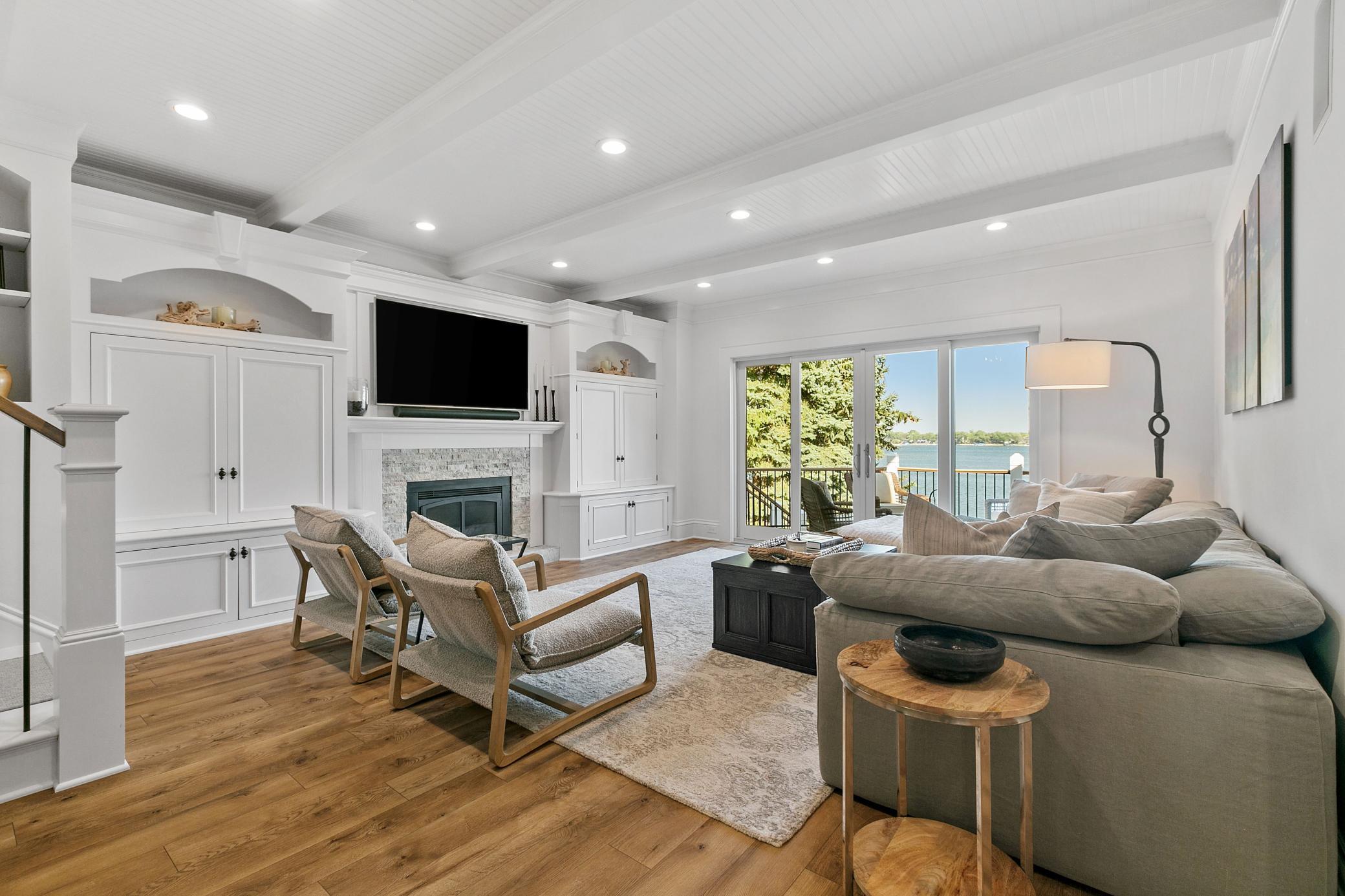 Warm and cozy main level living room with a patio door that you can open wide extending your living space to the outdoors.