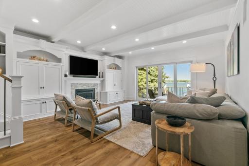 Warm and cozy main level living room with a patio door that you can open wide extending your living space to the outdoors.
