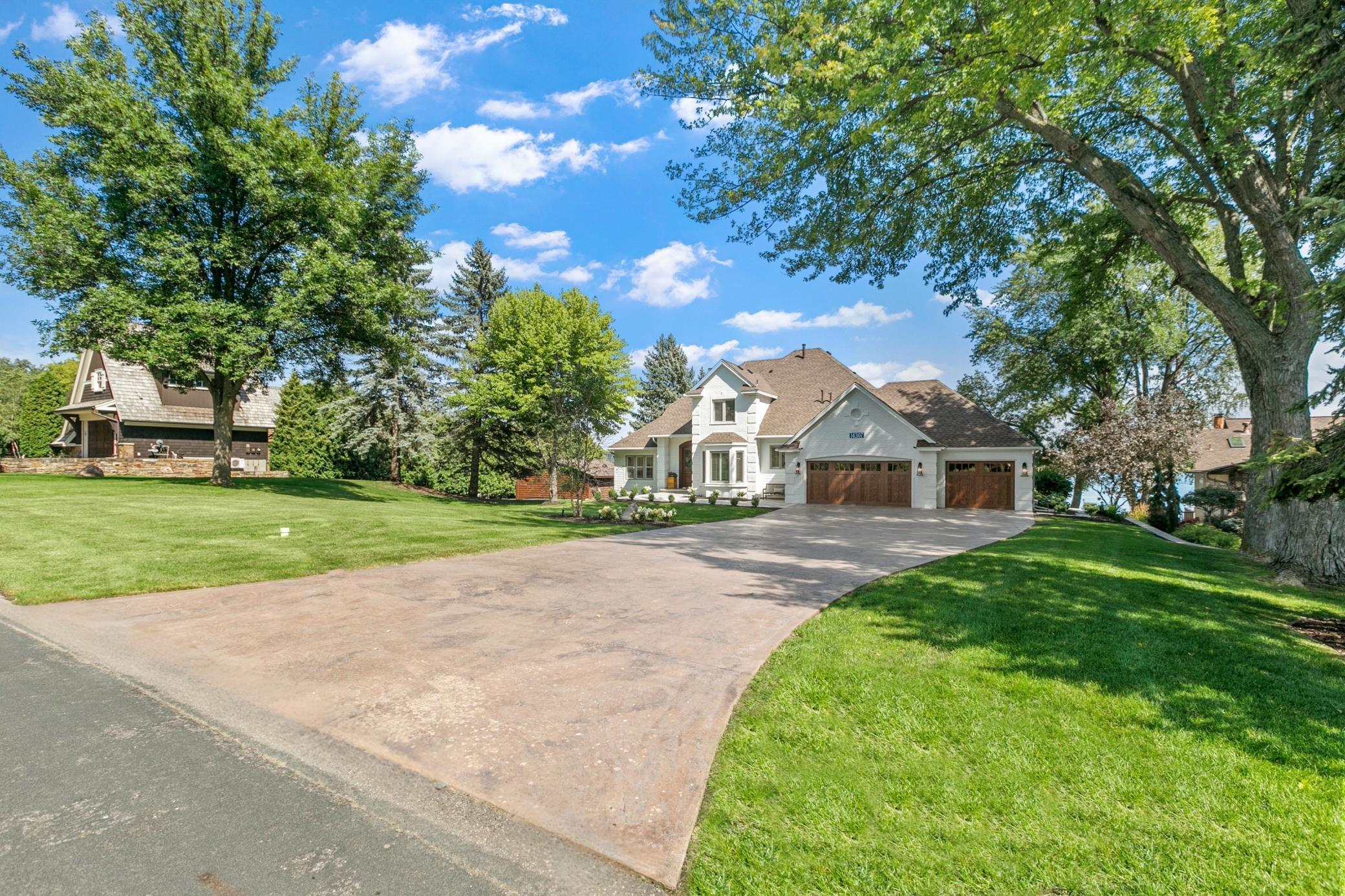 Stunning new listing on one of Prior Lake’s most prestigious streets, featuring beautiful landscaping and a welcoming front yard.