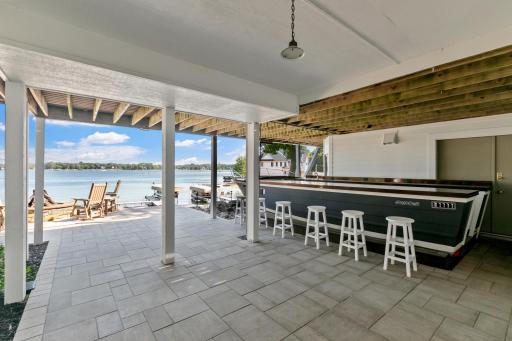 A truly unique outdoor entertaining space featuring a custom boat bar that will be the highlight of every gathering.