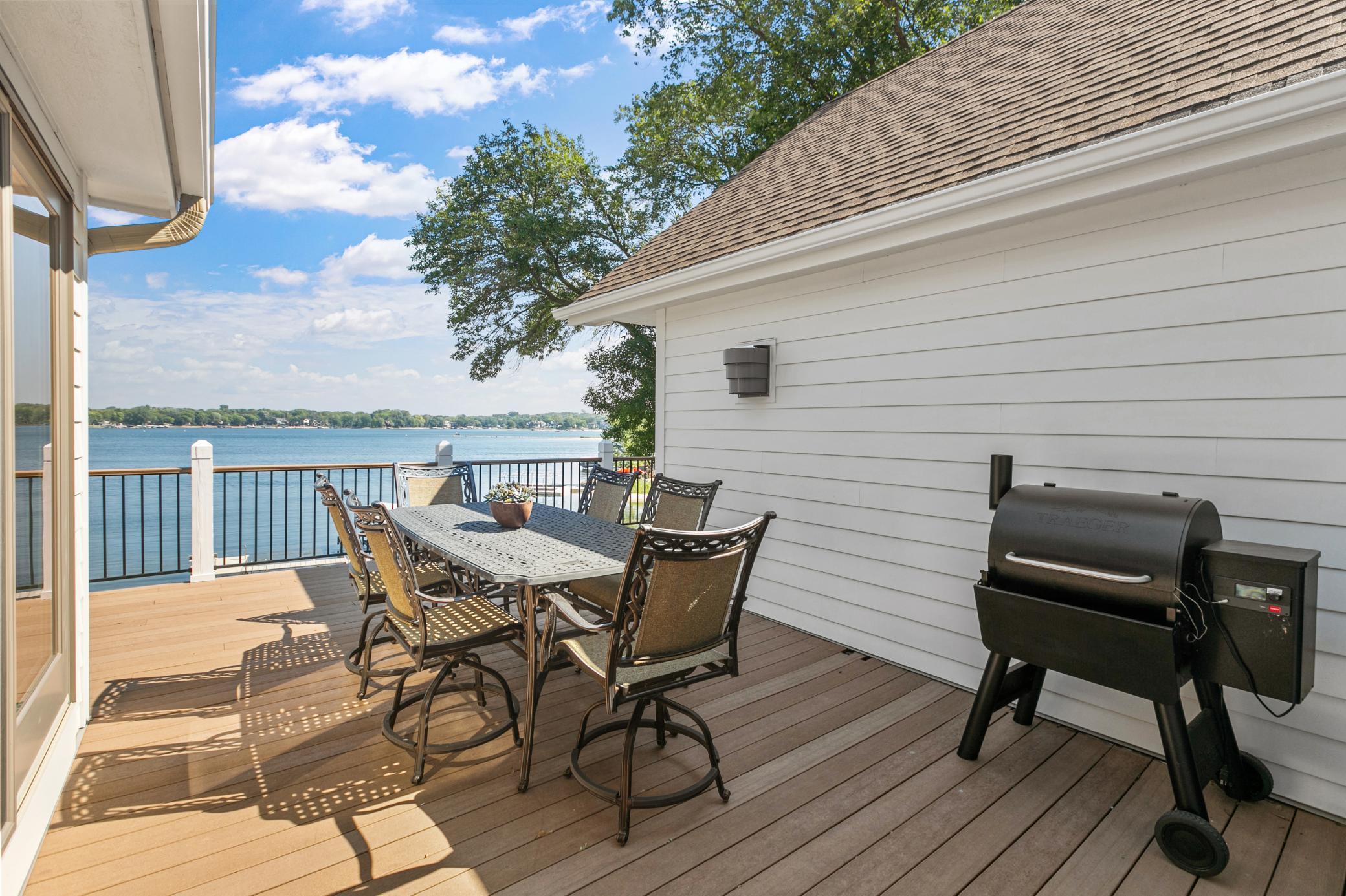 Outdoor dining space is tucked away for privacy and shade for comfort!