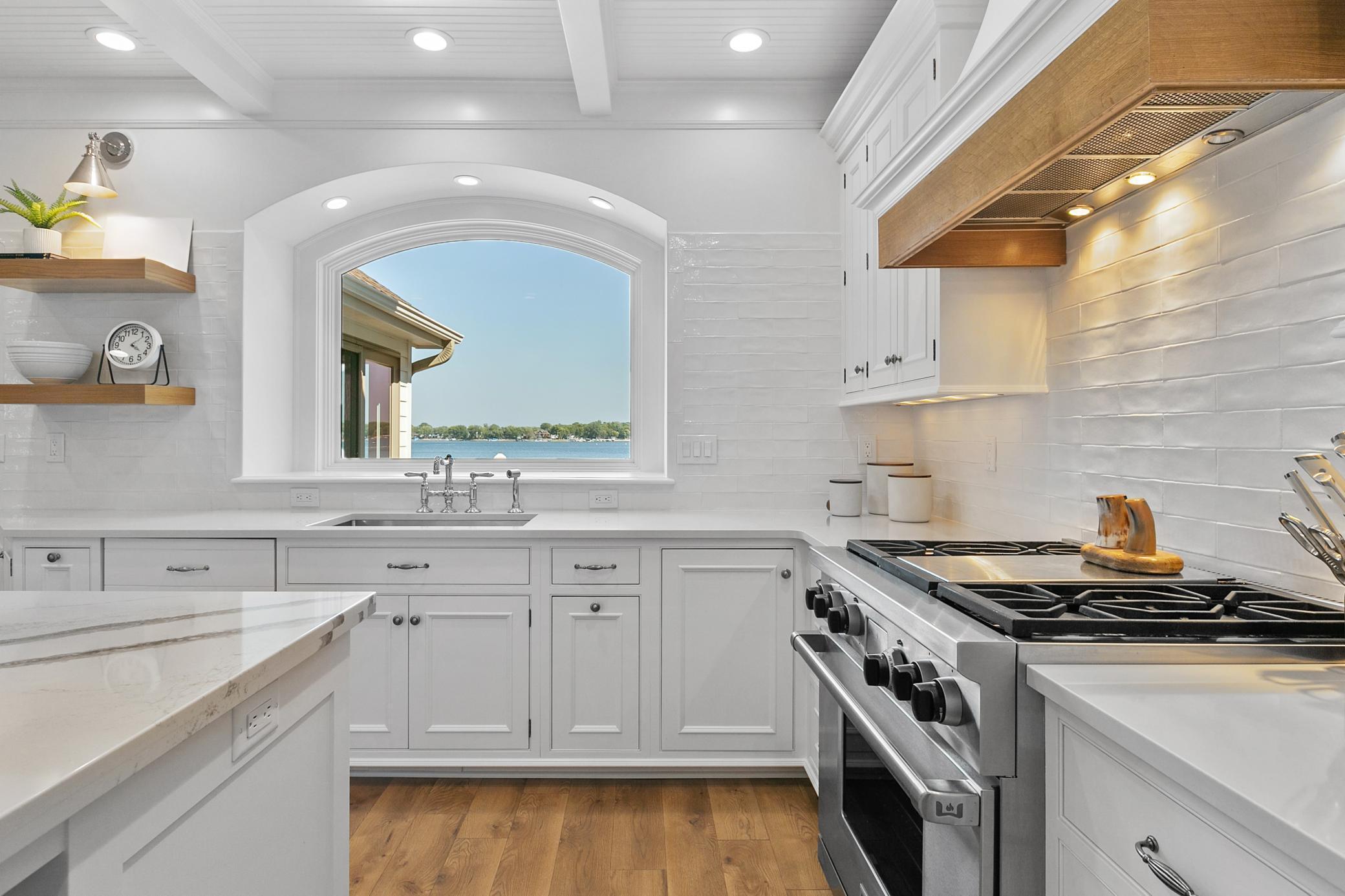 Enjoy beautiful lake views right from the kitchen, complemented by luxury appliances and a thoughtfully designed cooking space.