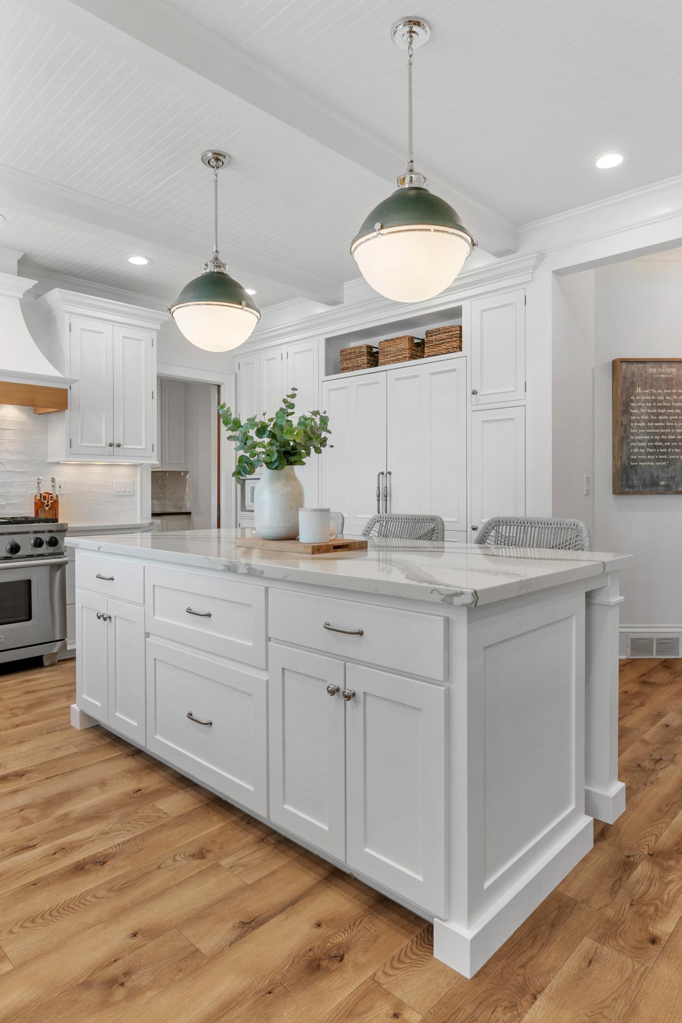 The kitchen island offers ample cabinet storage along with generous space for gathering and everyday living.