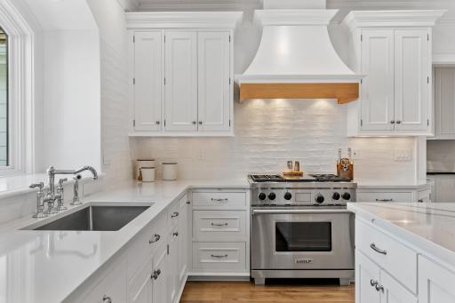 Enjoy beautiful lake views right from the kitchen, complemented by luxury appliances and a thoughtfully designed cooking space.