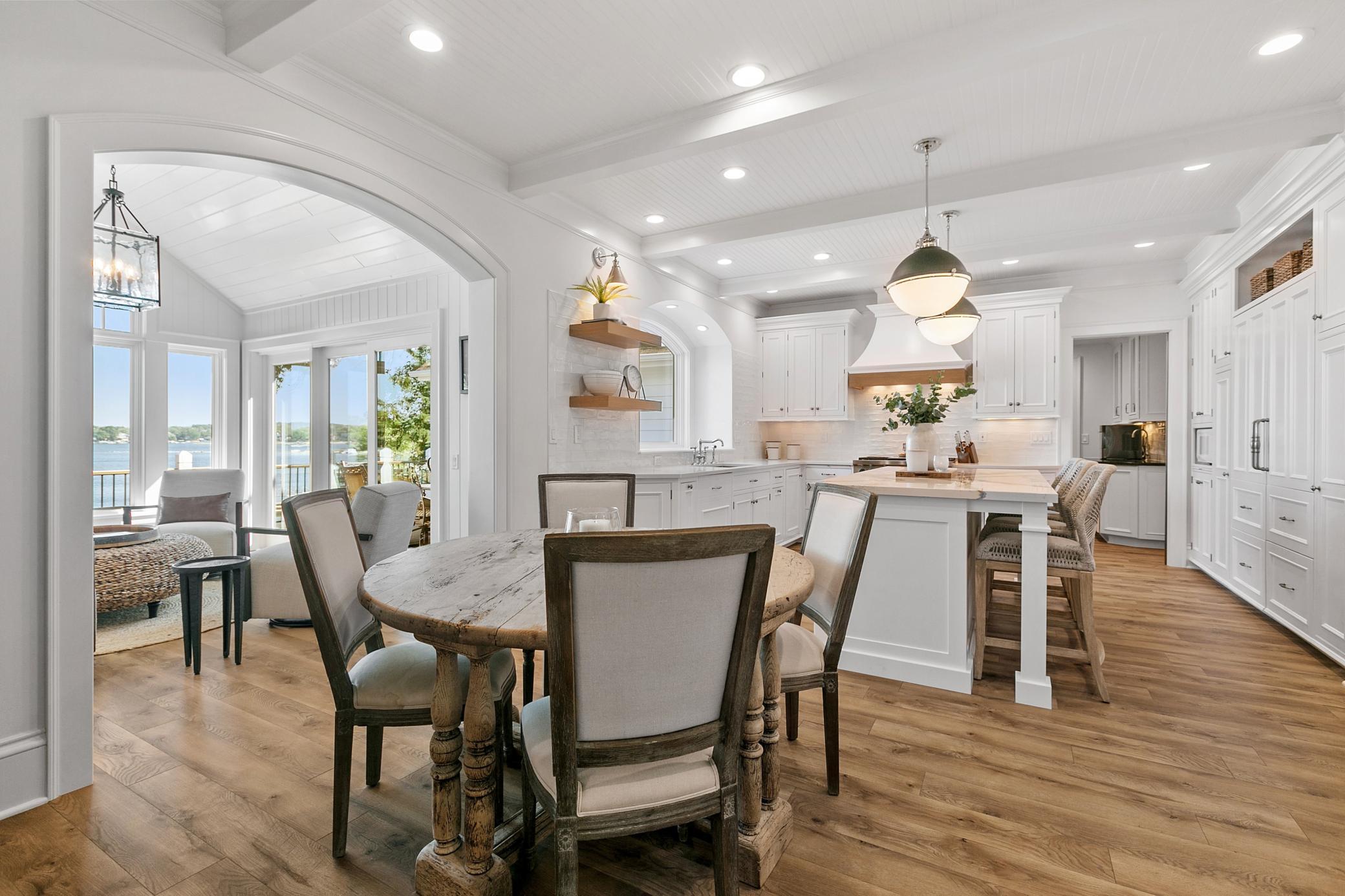 Enjoy meals at the kitchen table while taking in beautiful lake views, with the sun room just steps away.