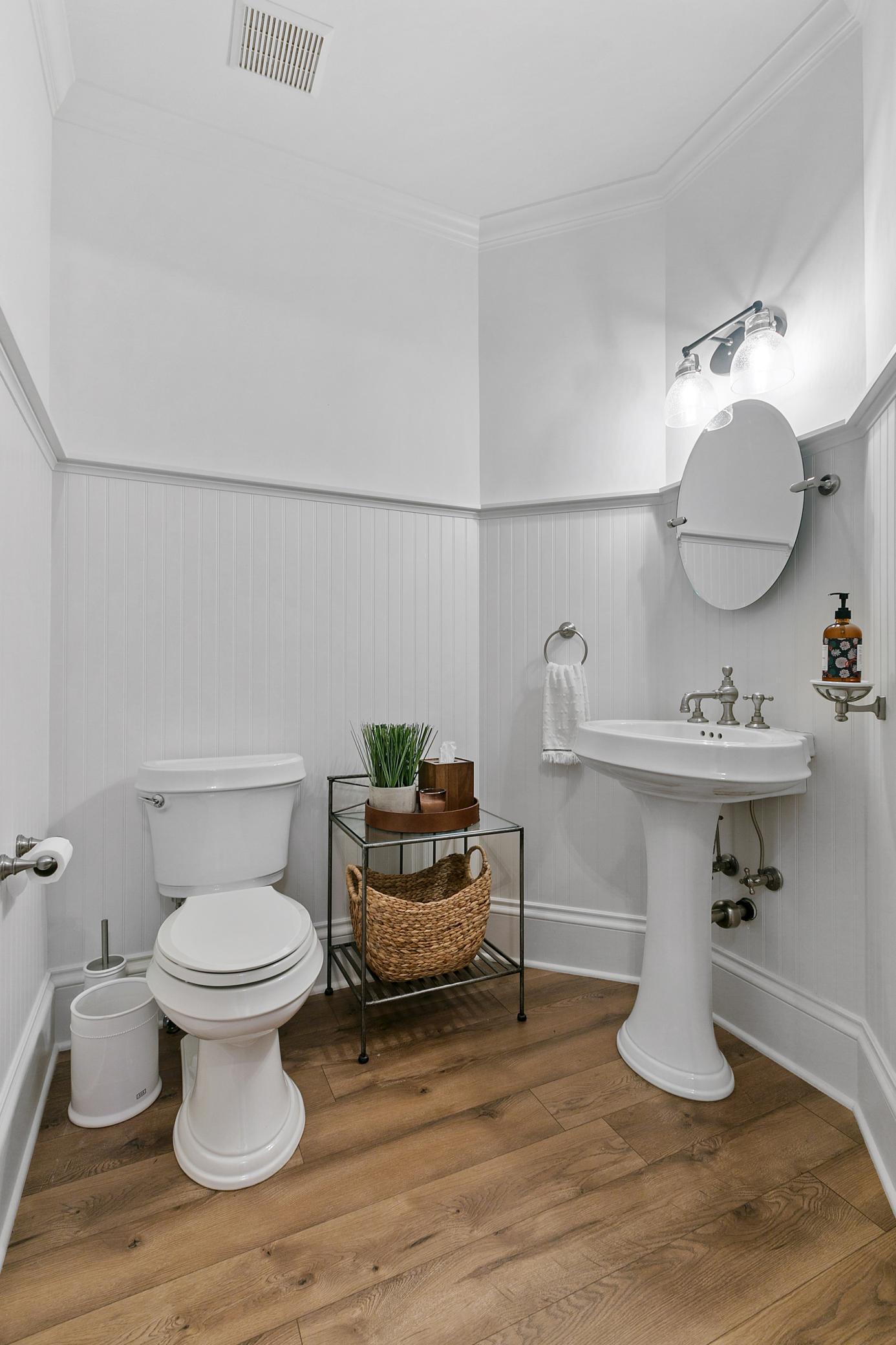 Convenient powder room thoughtfully located right in the center of the main level for guests and everyday use.