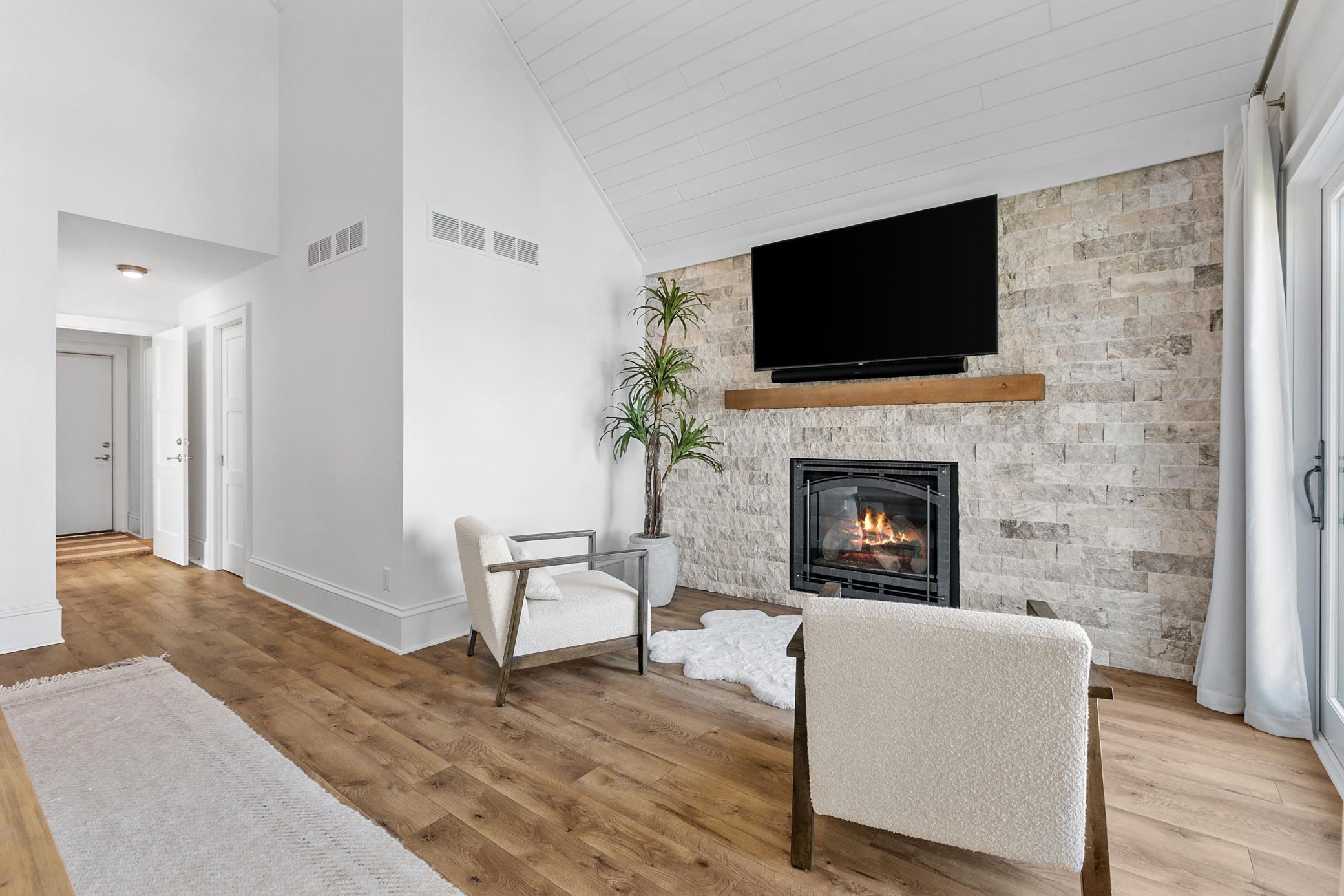 The primary suite fireplace creates a warm and inviting space to unwind at the end of the day.