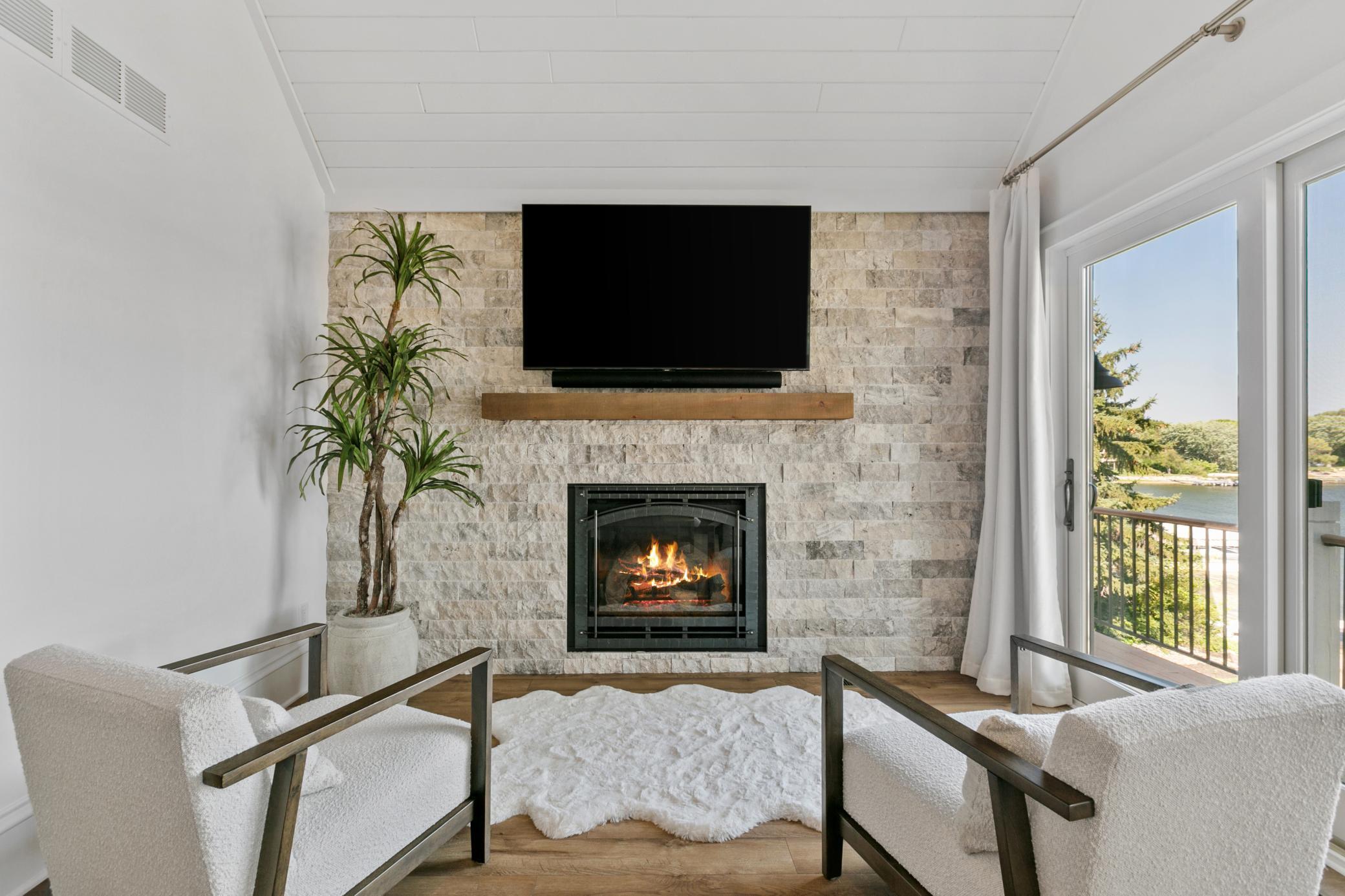 The primary suite fireplace creates a warm and inviting space to unwind at the end of the day.
