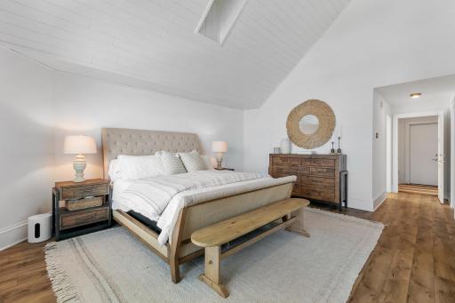 Spacious primary suite with soaring vaulted ceilings, designed as a peaceful retreat with elegant finishes and thoughtful details throughout.
