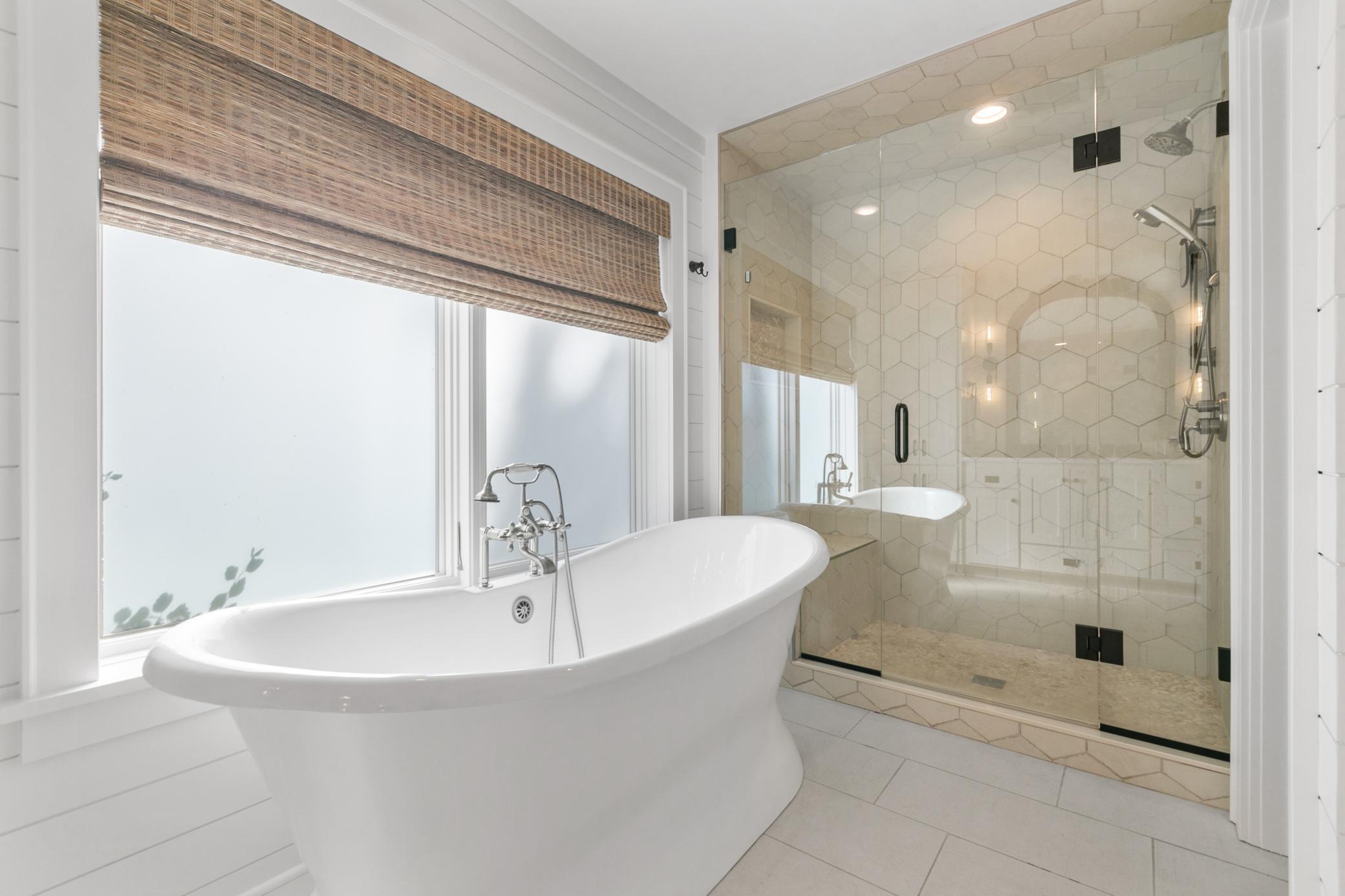 Relax and unwind in the elegant soaking tub, a perfect place to enjoy a peaceful moment at the end of the day.