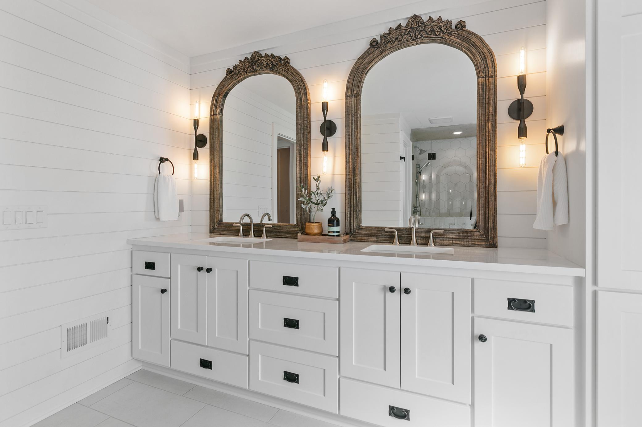 Spa-like primary bathroom featuring heated floors and beautiful coastal-inspired finishes that create a true retreat.