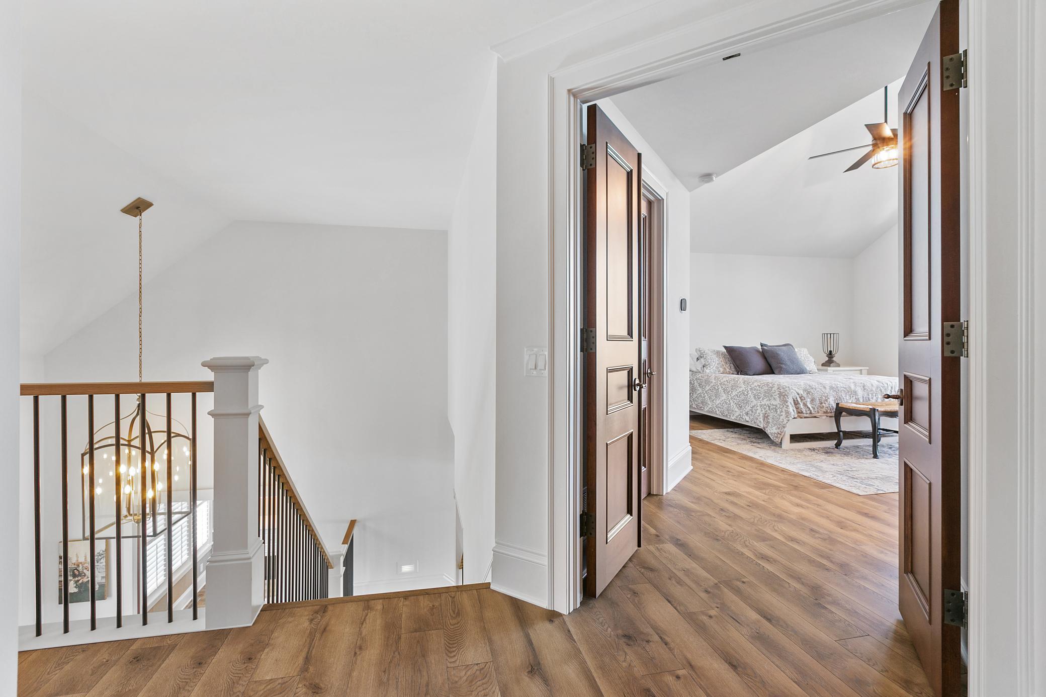 At the top of the stairs is a second primary suite!