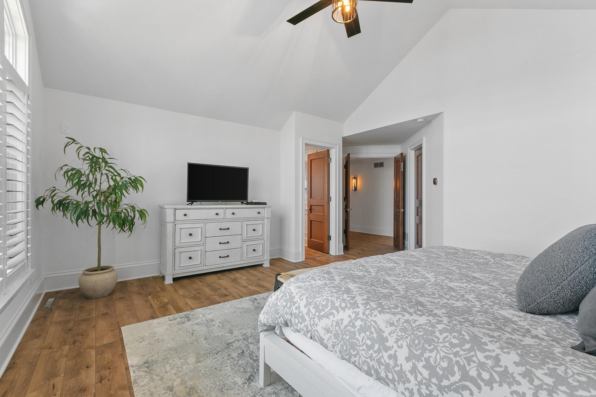 Double doors lead you in the upper primary bedroom with peaceful lake views to wake up to each day.