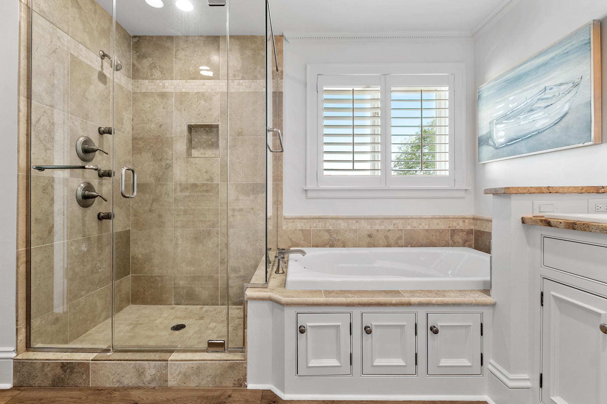 Multiple jets and shower heads in this upper level primary suite!