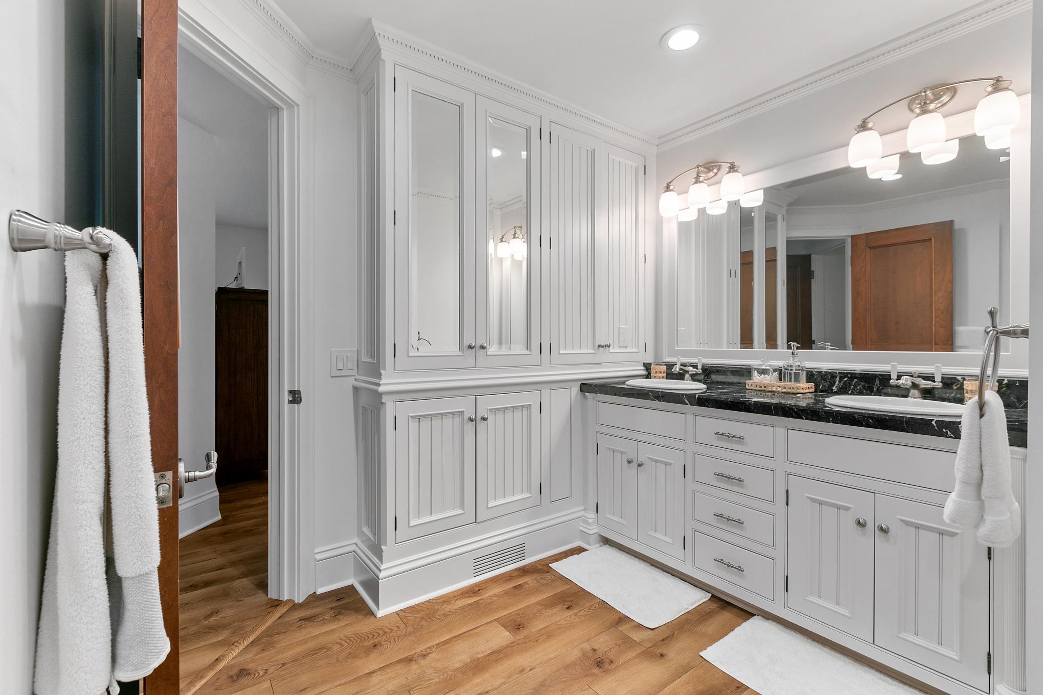 Accessed from bedrooms #3 & #4, this bathroom has a charming nautical flair!