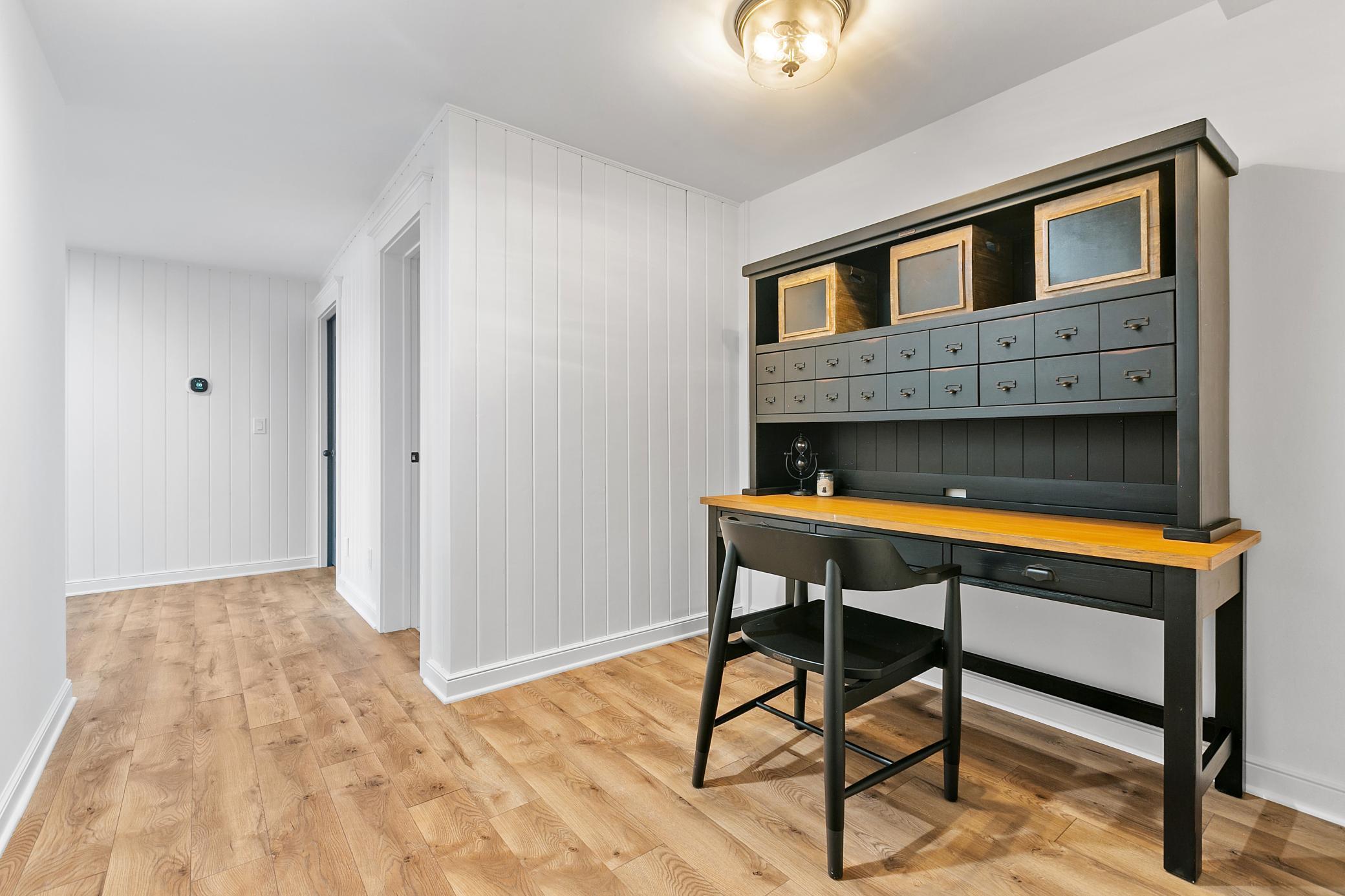 This hallway entrance from the family room to the fifth bedroom adds great space for kids, luggage, etc.