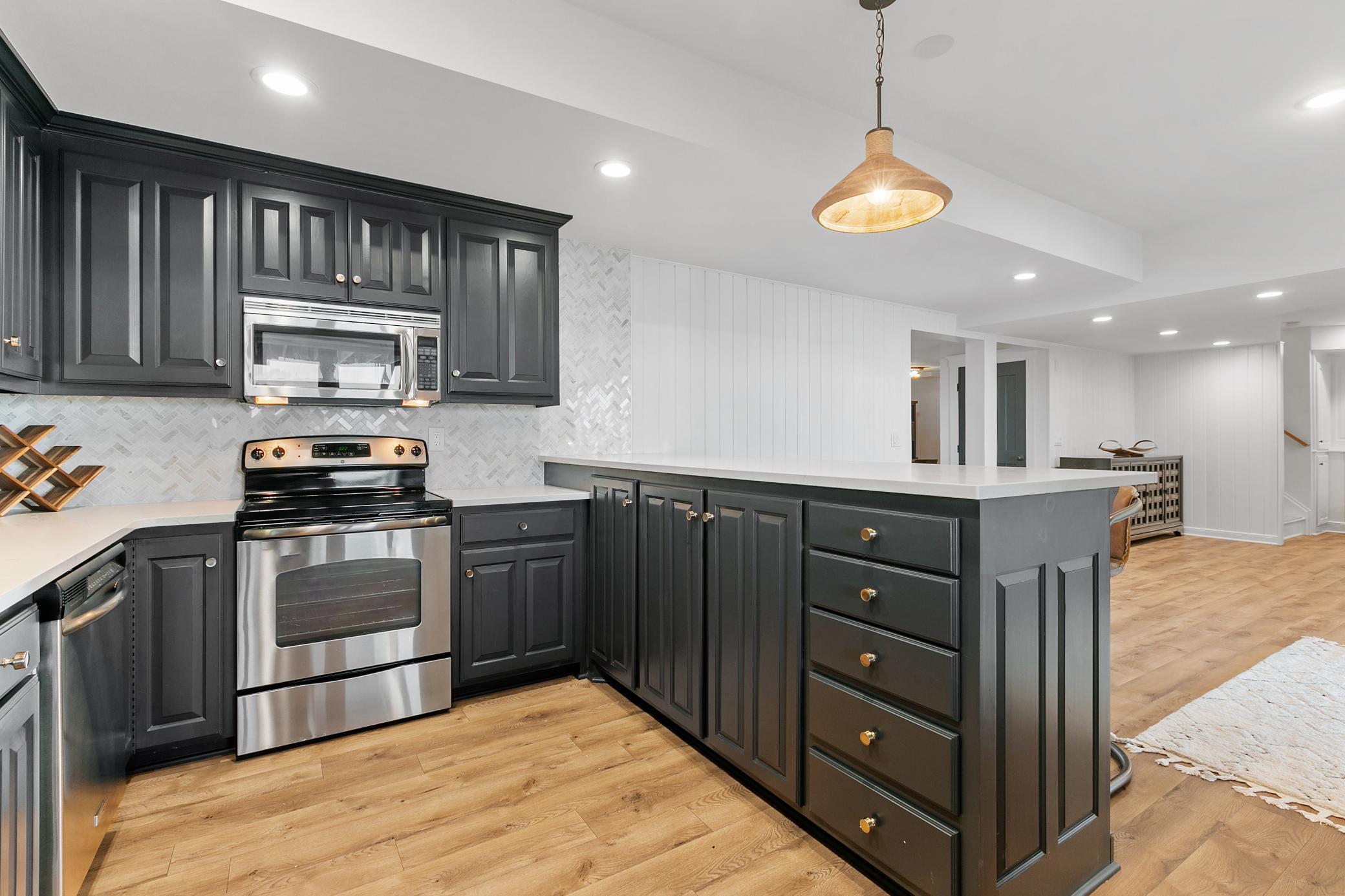 More nautical details with gold hardware and this beautiful cabinet color!