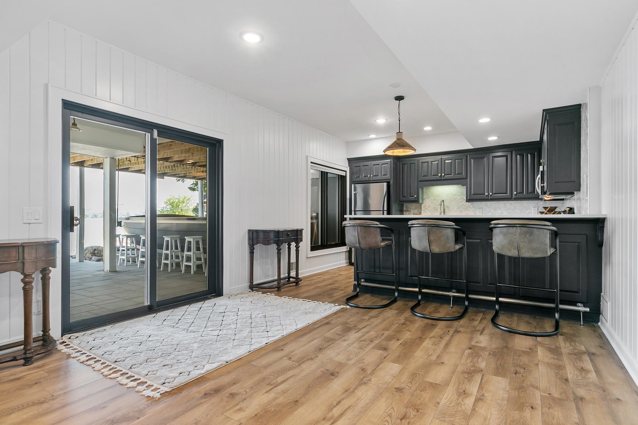 Convenient lower-level kitchen located just steps from the walkout, making it easy to prepare food and drinks while entertaining outdoors.