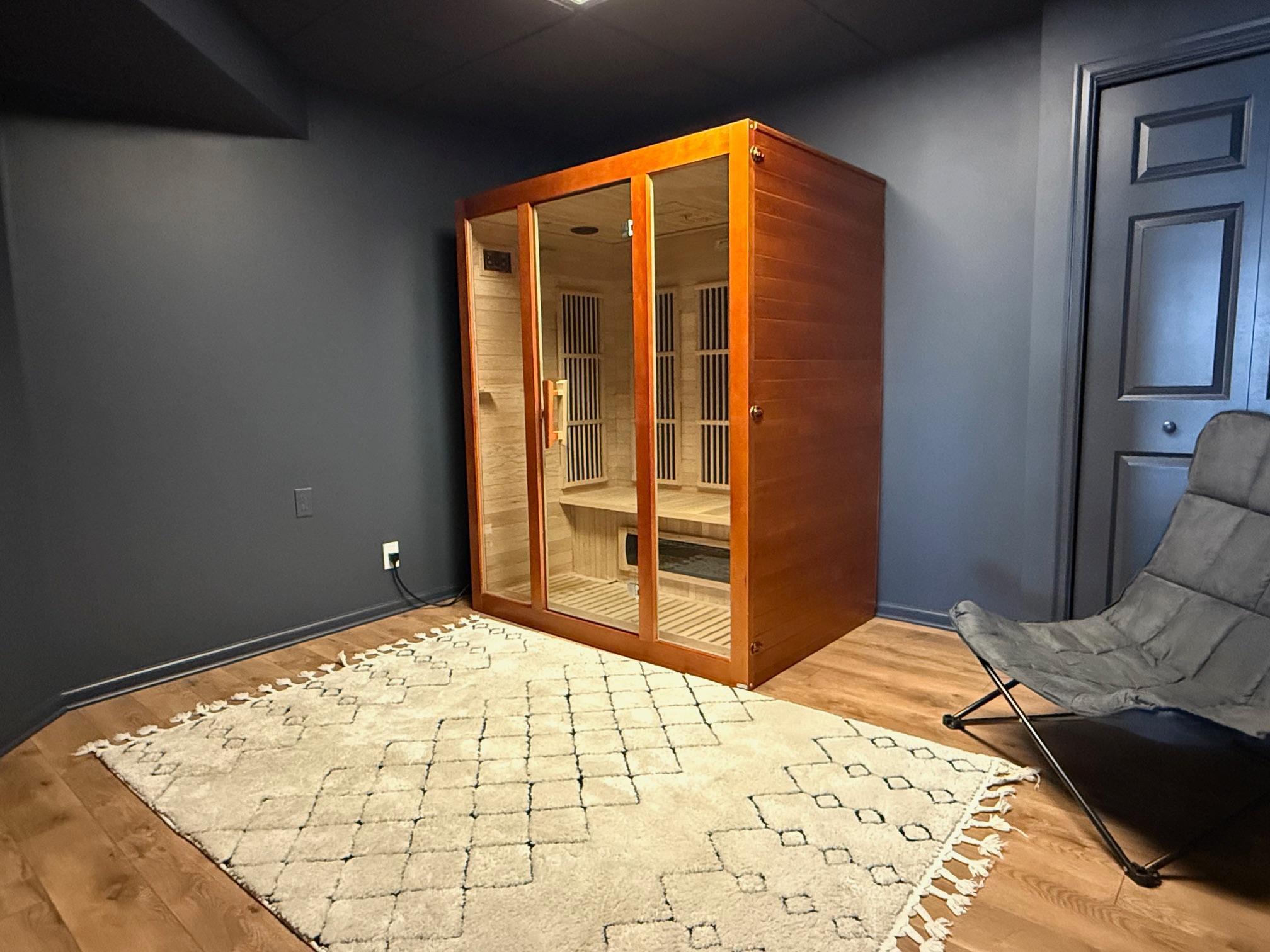 Color drenched room in the basement is a perfect flex space for play, storage, hobbies or the Sauna Suite as shown!