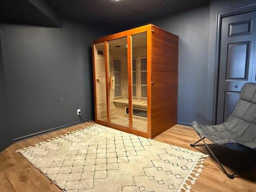 Color drenched room in the basement is a perfect flex space for play, storage, hobbies or the Sauna Suite as shown!