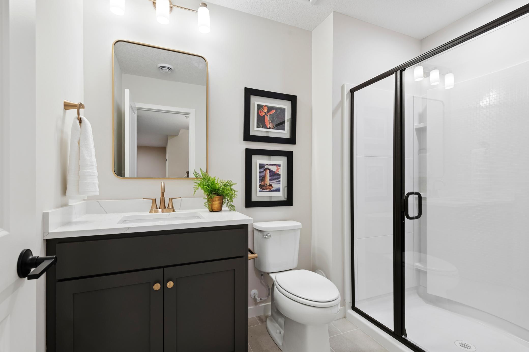 Lower level 3/4 bath. *Photos are of like home and may not depict actual home plan. Configurations, features, materials and finishes may contain options that are not included in the price.