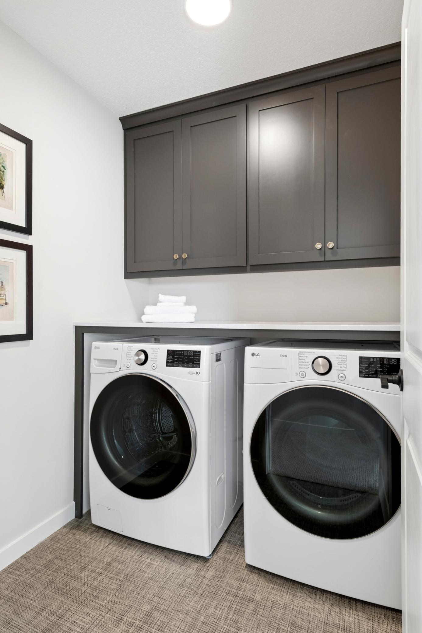 Upstairs laundry room . *Photos are of like home and may not depict actual home plan. Configurations, features, materials and finishes may contain options that are not included in the price.