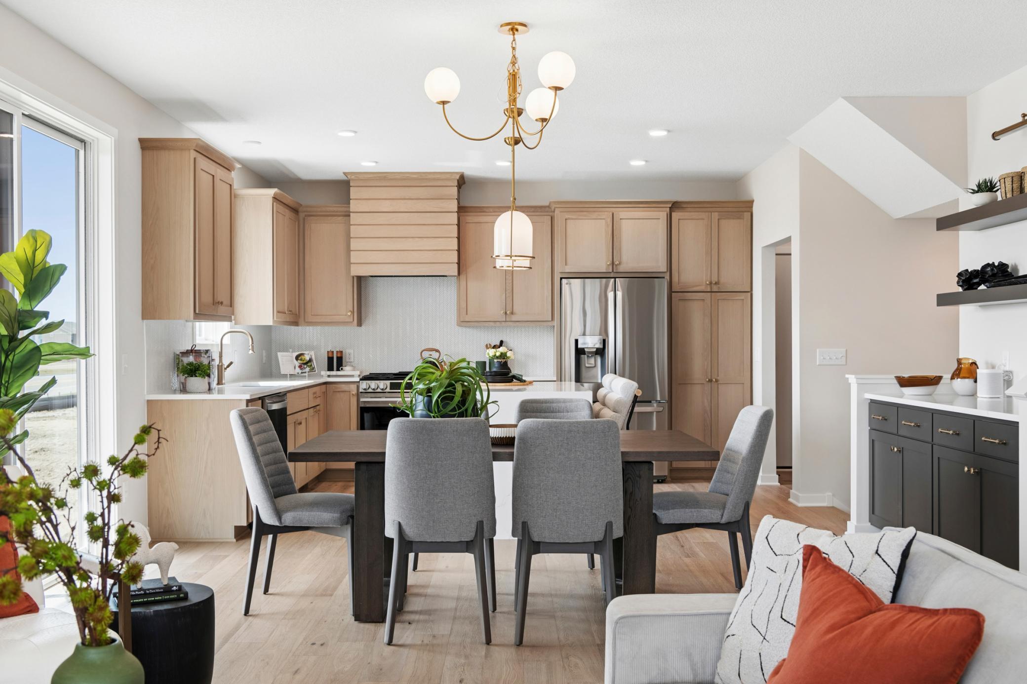 Bright and inviting kitchen featuring ample cabinetry and generous counter space. *Photos are of like home and may not depict actual home plan. Configurations, features, materials and finishes may contain options that are not included in the price.