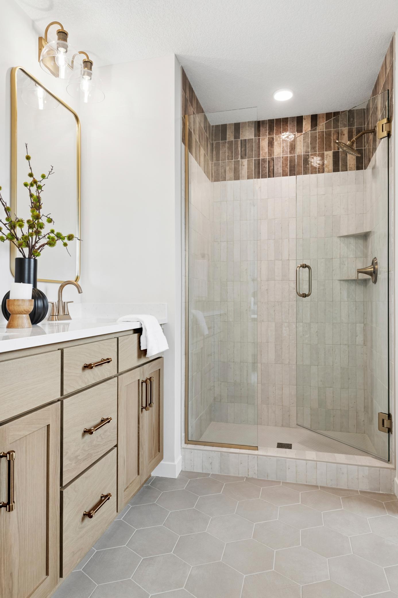 Beautiful modern primary bath featuring a spa-like walk-in shower. *Photos are of like home and may not depict actual home plan. Configurations, features, materials and finishes may contain options that are not included in the price.