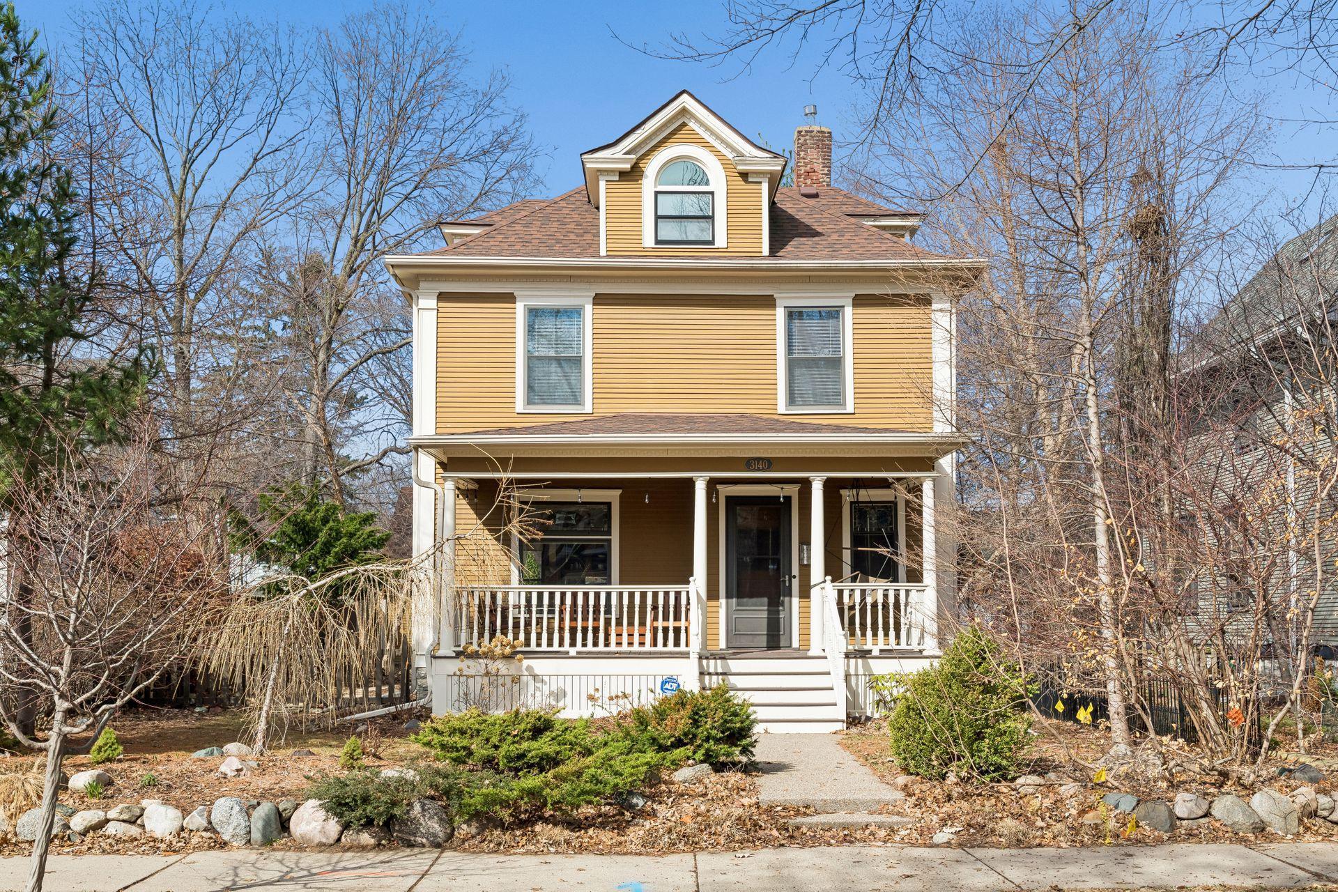 Landscaped yard with ornamental trees.