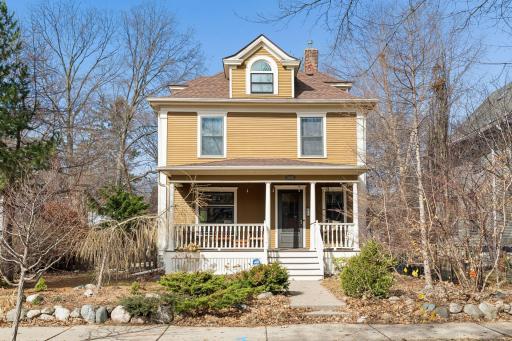 Landscaped yard with ornamental trees.