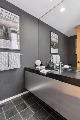 A fresh, contemporary update to the main-level Powder Room, featuring new fixtures and clean, modern details.
