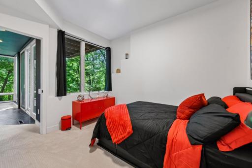 A newly finished Guest Bedroom offers a private and polished retreat within the lower-level wing, with contemporary finishes and a serene feel.