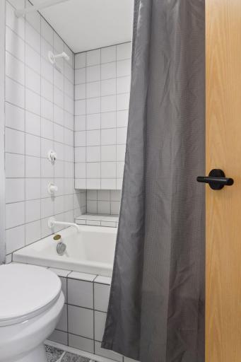 The tub and shower are set within their own separate space, offering added privacy within the Full Bathroom.